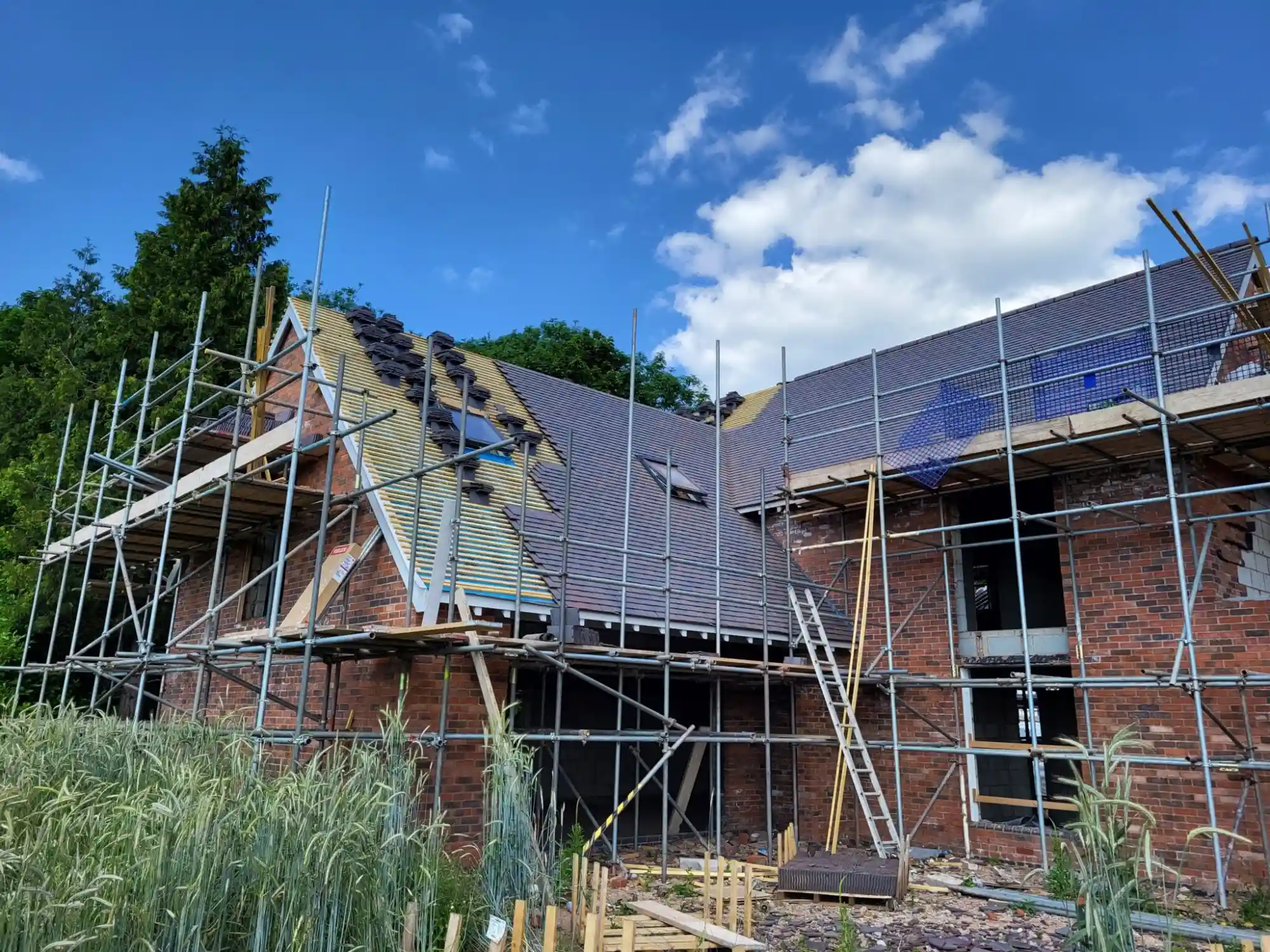 new build roofing project with scaffolding